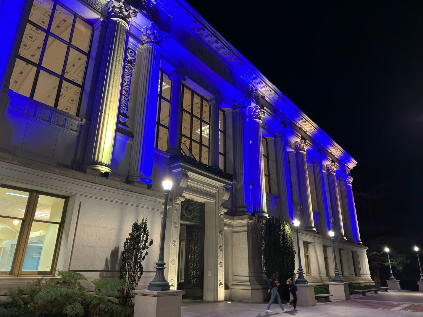 A building with columns and blue lightsAI-generated content may be incorrect.
